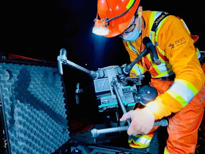 A miner setting up a drone for stope mining operation